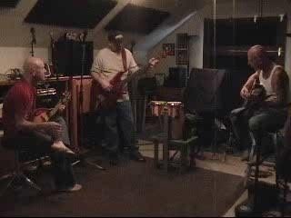 Bob Houghton, Brian Curry, and a third musician playing music together in a home studio