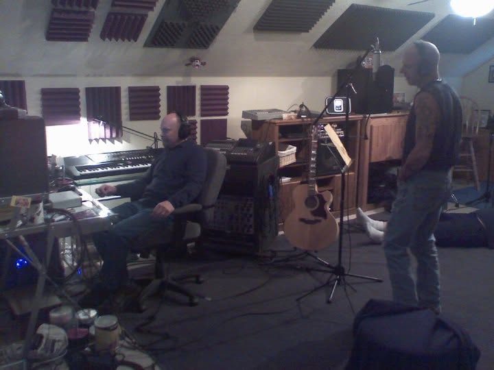 Bob Houghton and Brian Curry working together in a home recording studio